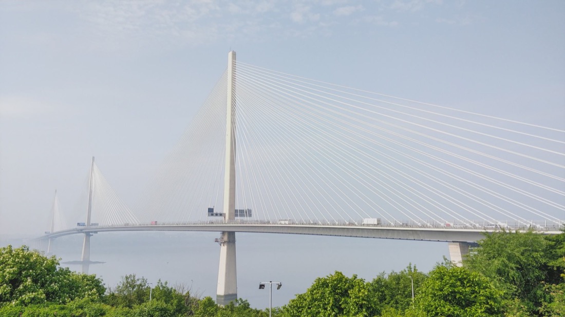 Queensferry Crossing Bridge with green plants in South Queensferry