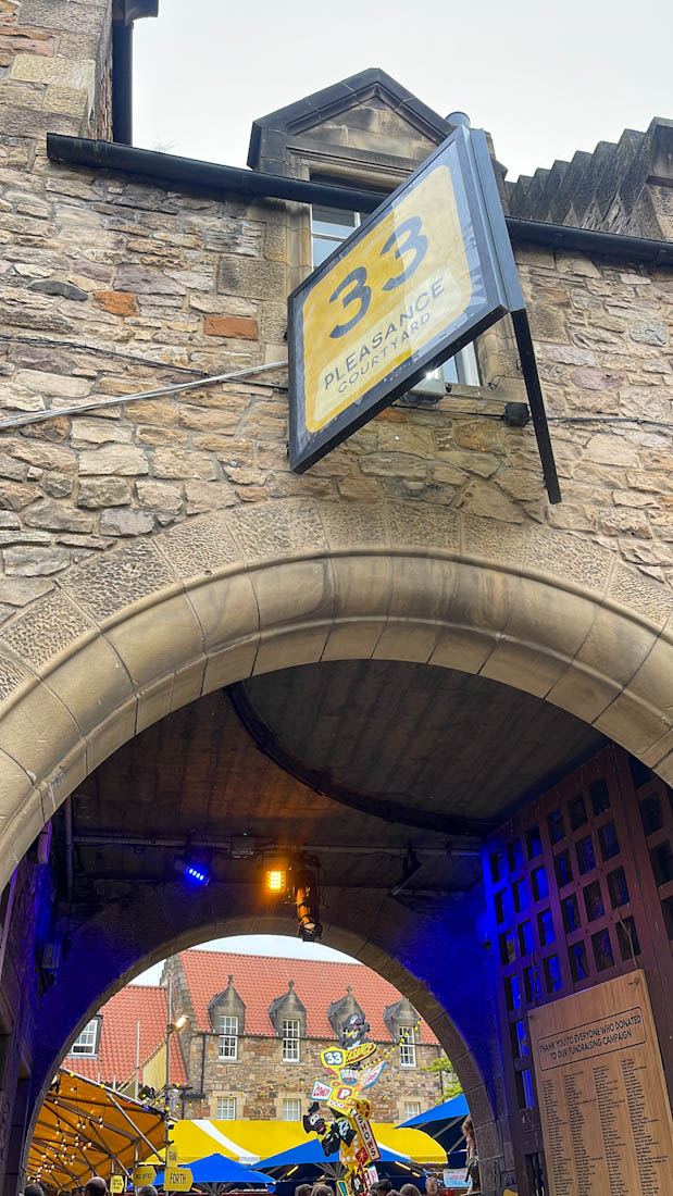 Pleasance arch with Fringe sign in Edinburgh