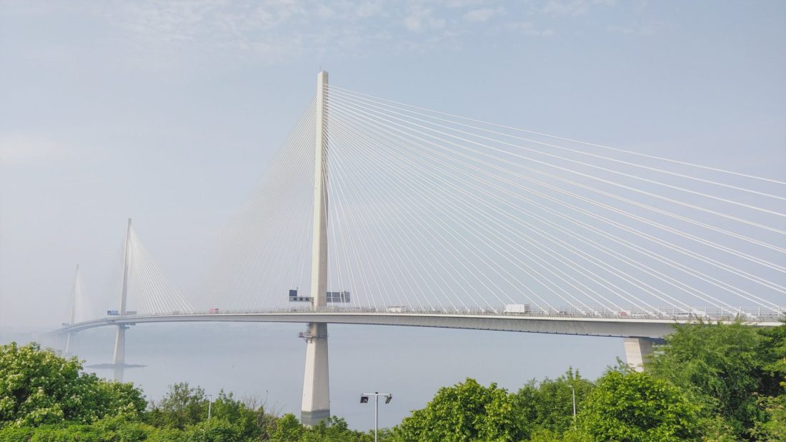 Queensferry Crossing with green tress from North Queensferry DoubleTree hotel