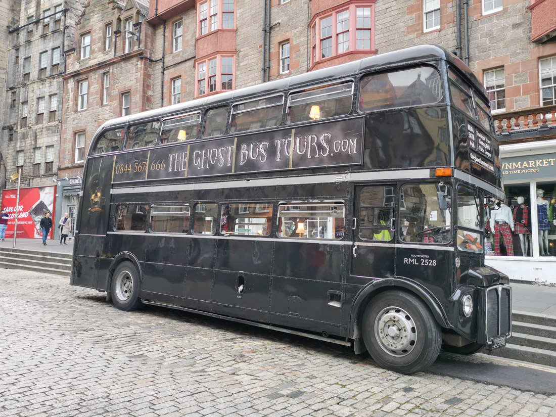 Ghost Bus parked on Royal Mile cobble streets in Edinburgh