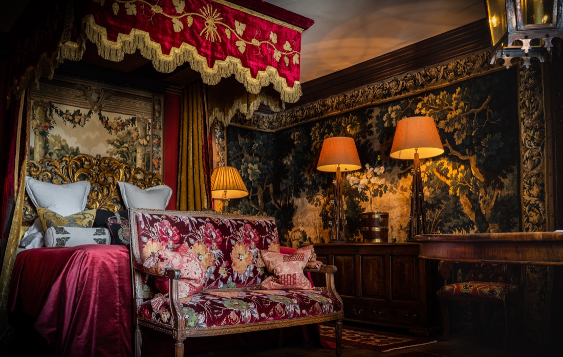 Dark, red luxurious room called The Turret Suite Witchery Edinburgh Hotel