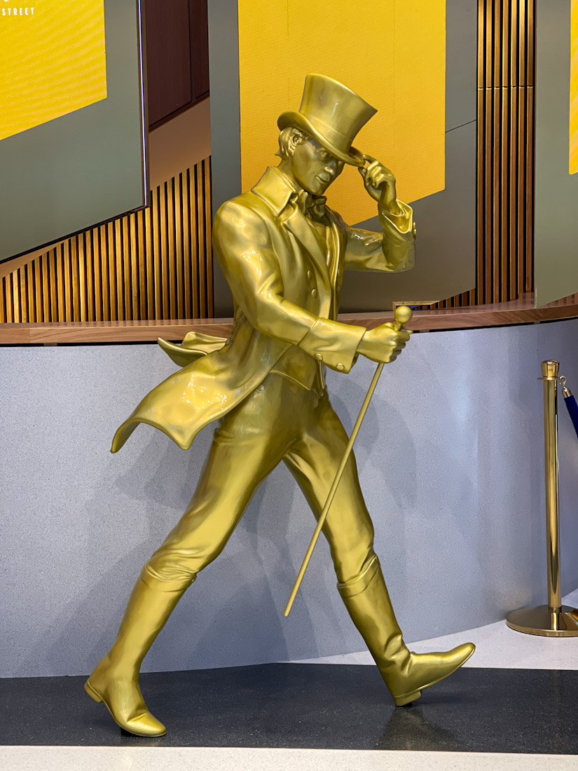 Johnnie Walker Experience statue of man in hat and stick walking