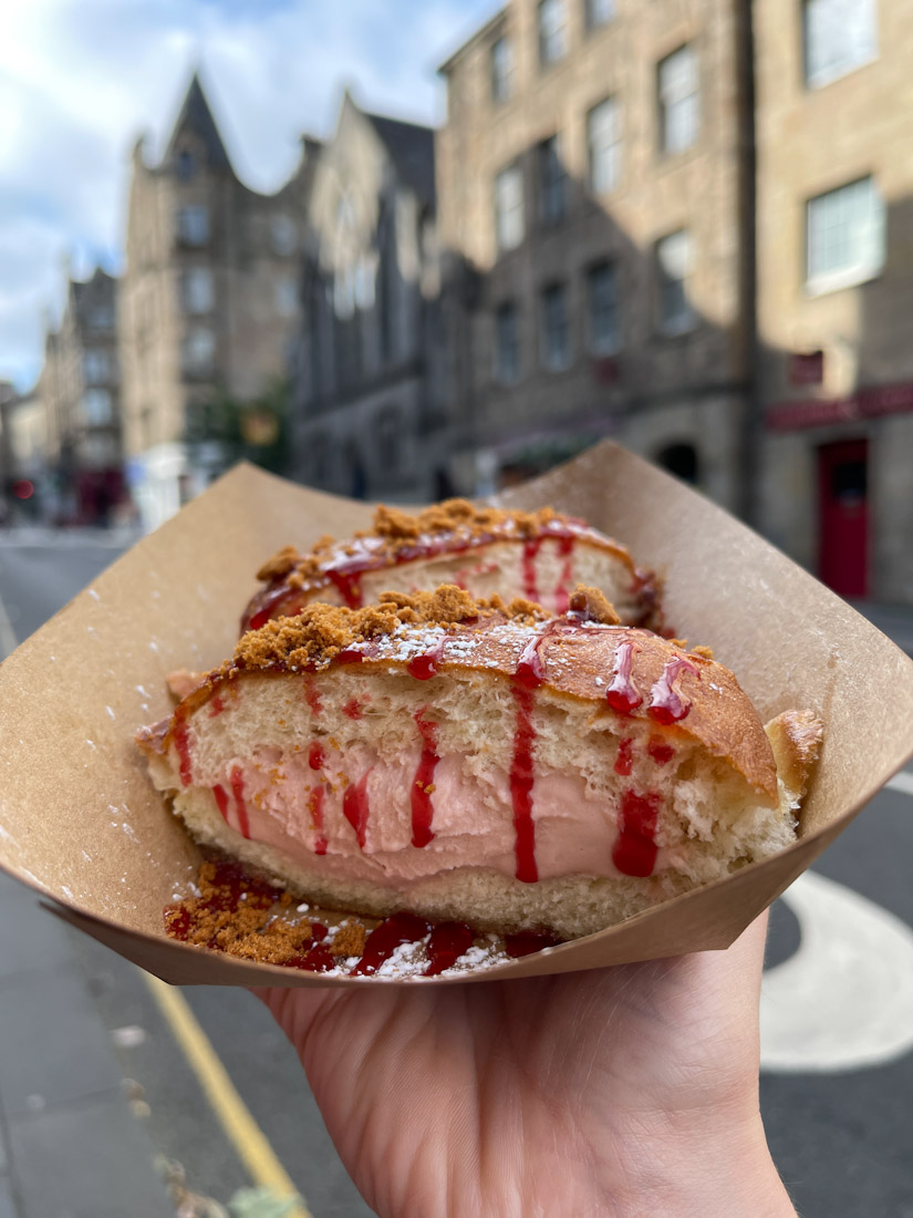 Smoov cafe gelato donut in front of Royal Mile buildings in Edinburgh