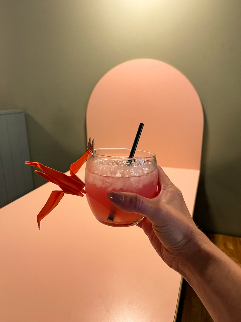 Hand holding cocktail at Hau Han Chinese 