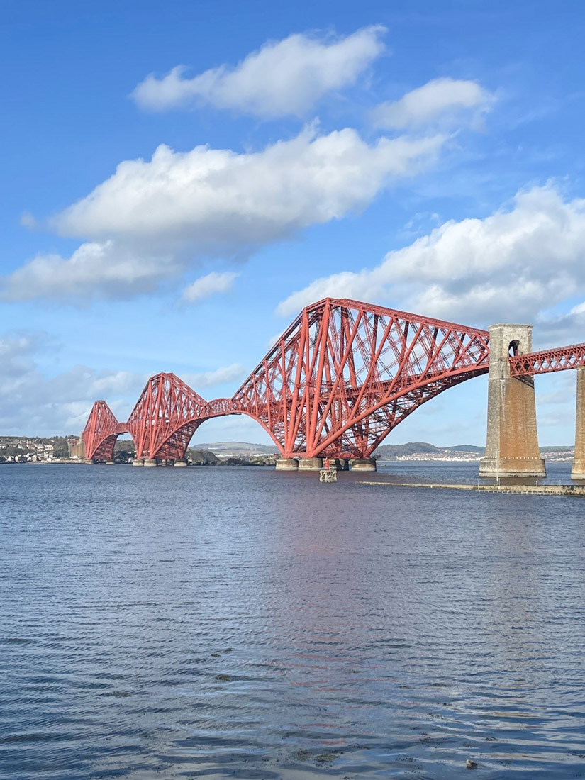 Forth Bridge over deep blue River Forth in South Queensferry