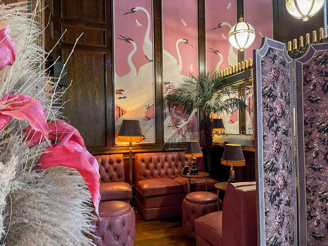House of Gods bar with Gucci wallpaper pink with white herons