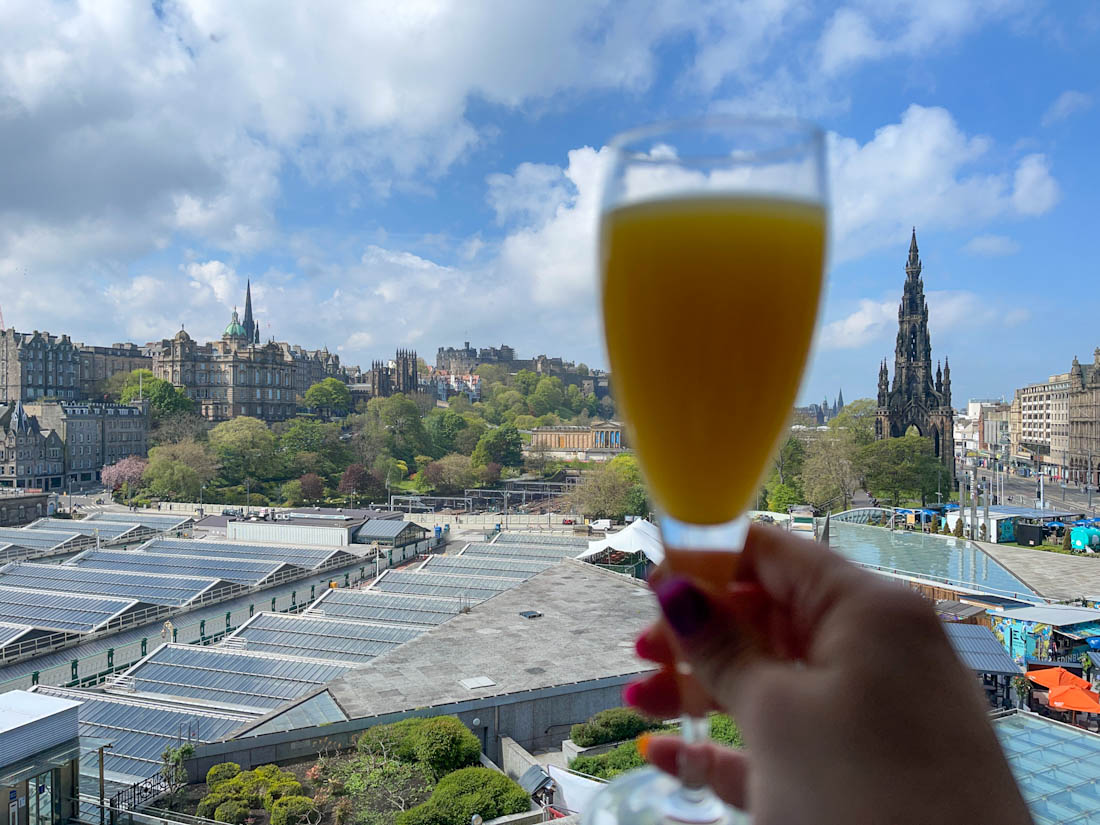 Views from The Balmoral Hotel and a hand holding a mimosa