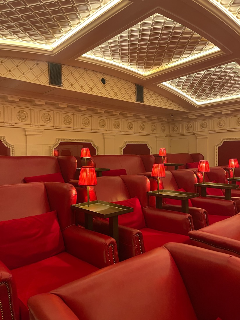 Red chairs and tables with lights at Scotsmand Picturehouse Edinburgh