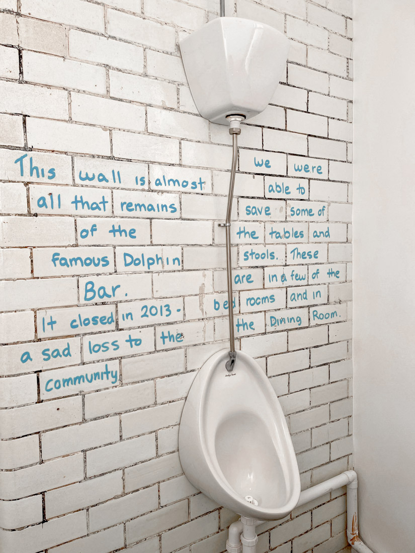 The Dolphin Inn Hostel toilet Dolphin Bar wall with urinal Dunbar