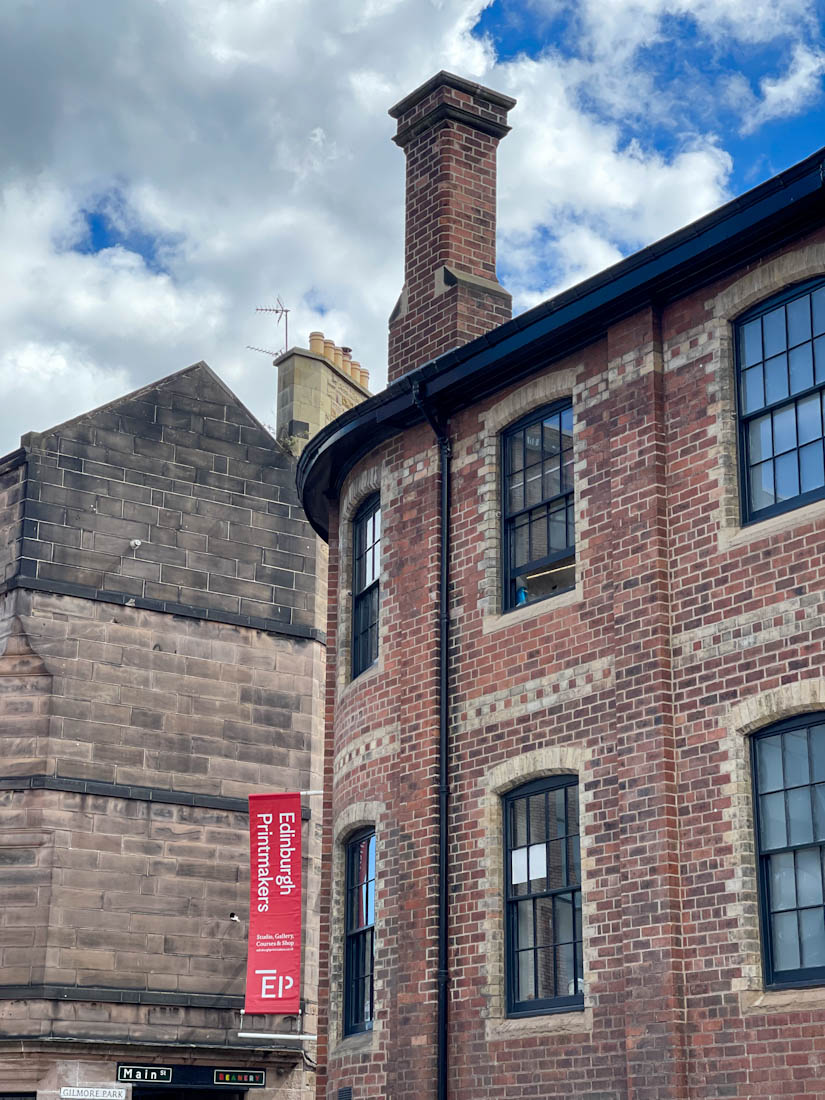 Edinburgh Printmakers red sign on red brick building