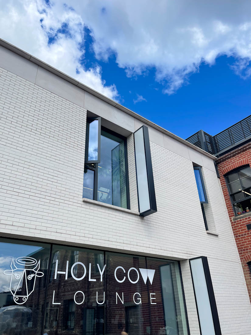 Holy Cow Lounge sign in window