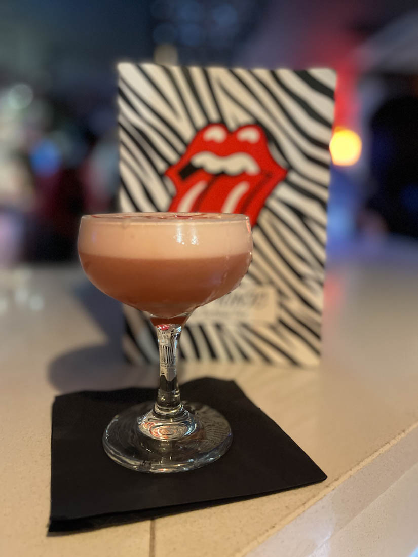 Tonic Bar in Edinburgh Cocktail Glass in front of blurred Menu