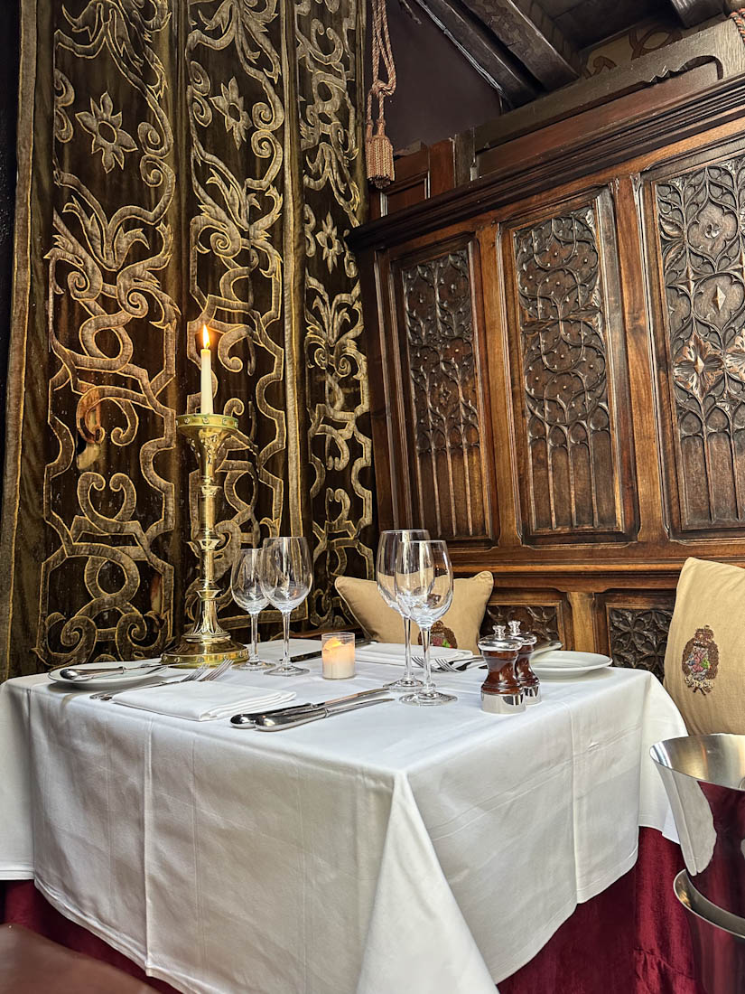 Set table at the gothic Secret Garden room in The Witchery restaurant in Edinburgh